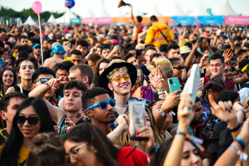 Dense daytime crowd at an outdoor festival